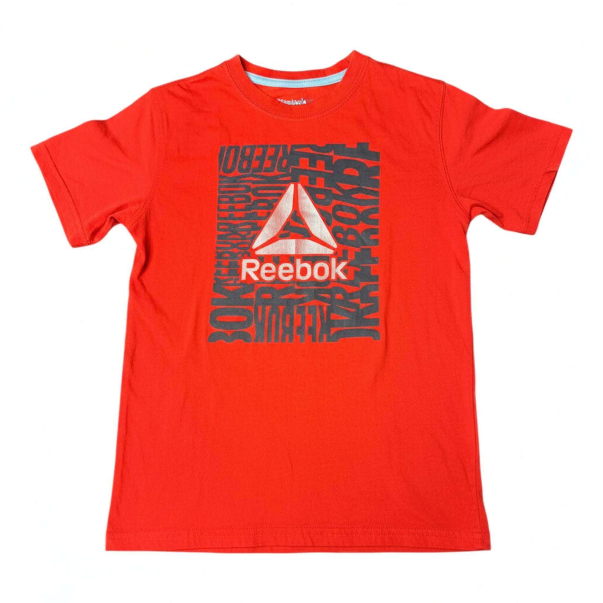 Polera Reebok Naranjo 8 años seleccionada por NÜVA